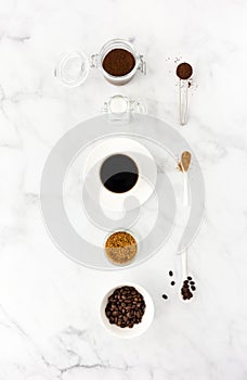 Black Coffee in Cup, Sugar, Ground Coffee and Beans