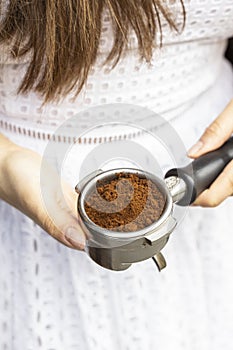Black coffee ground arabica in horn