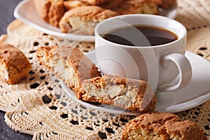 Black coffee and Italian cookies cantuccini macro. Horizontal