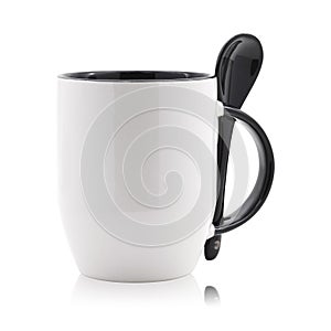 Black coffee mug and spoon isolated on white background. Empty tea cup for your design.  Clipping paths