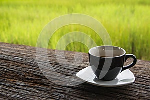 Black coffee mug on wooden