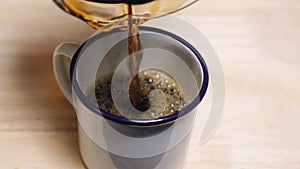 Black Coffee Pouring Into A Cup