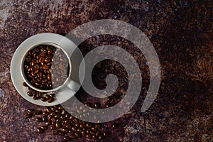 Black coffee seed for morning menu in white ceramic cup with coffee beans roasted