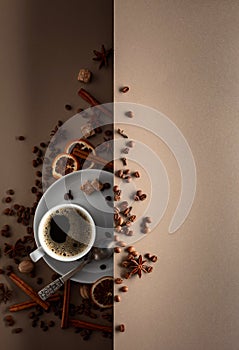 Black coffee with spices on a beige background