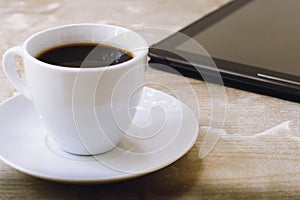 Black coffee and a tablet