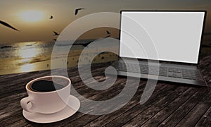 Black coffee in white cup on wooden surface table. Blur blank screen labtop , Black smartphone  white screen  on table. Copy space