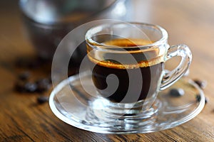 Black coffee on wood background