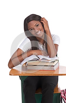 Black college student woman with book by desk