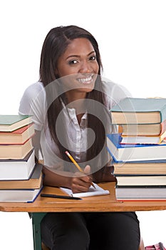 Black college student woman by stack of books