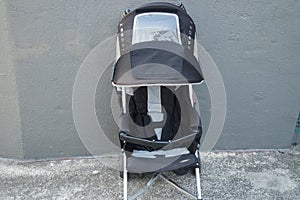 Black color baby stroller with head covering photo