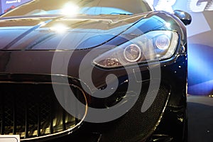 Black color car with front headlight and grills