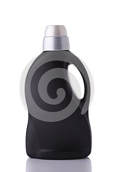 Black color fluid bottle on background