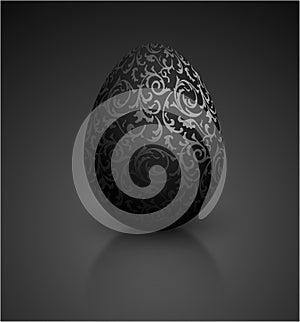 Black color mat realistic egg with metallic floral pattern. Isolated on black background with reflection. Vintage banner, card