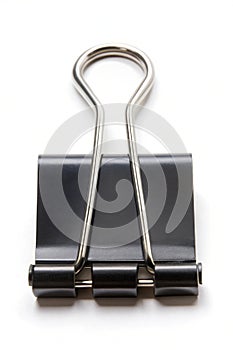 Black color paper binder clip or bulldog clip isolated on a white background. High resolution photo