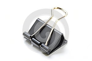 Black color paper binder clip or bulldog clip isolated on a white background. High resolution photo
