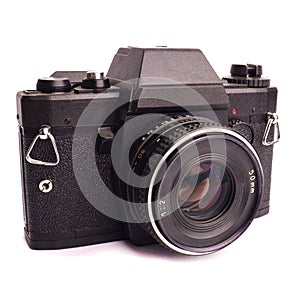 Black colored vintage old film camera with lens isolated