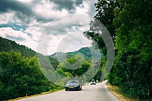 Black colour Audi car on background of French mountain nature landscape