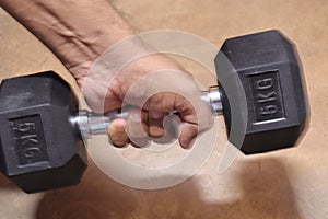 Black colour Gym Dumble for Fitness on Wood background