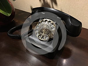 Hotel room - Old Black Dialling Telephone. photo