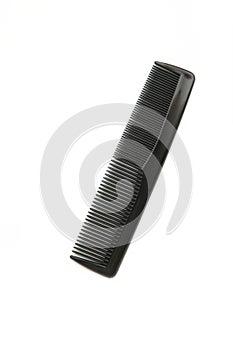 Black comb isolated on white background. Top view