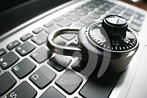 Black Combination Lock On Laptop Keyboard Representing Cyber Security