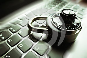 Black Combination Lock Zoom Burst On Laptop Keyboard Representing Cyber Security