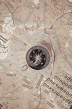 Black compass on routes on the world map discovery, navigation, communication, logistics, geography, transportation and