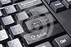 Black computer keyboard. Button enter close up. Modern equipment. Computer. Buttons. Background and texture.