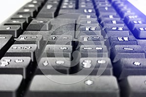 Black and computer keyboard close-up. Overlooking the enter button