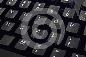 Black computer keyboard keys close up, background