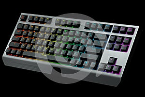 Black computer keyboard with rgb colors isolated on black background.
