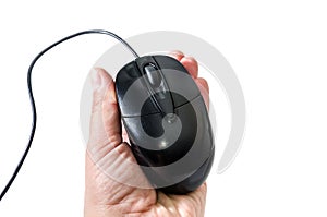 Black computer mouse in female hand isolated on white background
