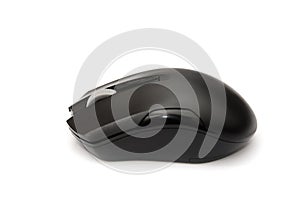 Black computer mouse in hand isolated on a white background. Close-up.