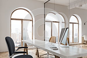 Black computer screen on a loft office table