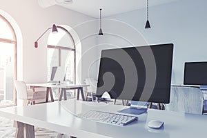 Black computer screen on an office table