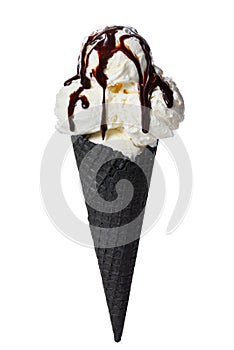 Black cone, wafer cup with scoops of ice cream poured chocolate glaze is isolated on white background