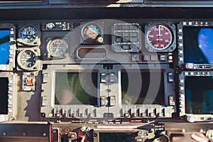 Black control panel in a helicopter cockpit.