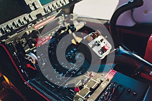 Black control panel in a helicopter cockpit.