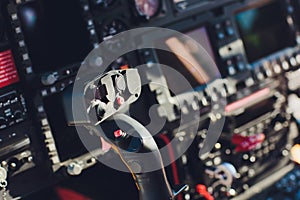 Black control panel in a helicopter cockpit.