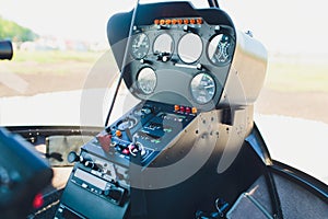 Black control panel in a helicopter cockpit.