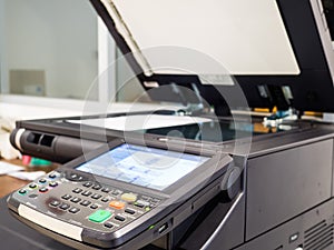 black copyer machine in use on the office
