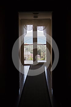 Black corridor and window with sea view