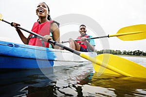 Black couple canoeing in a lake