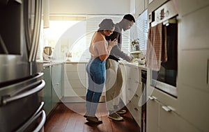 Black couple, cooking and food in kitchen at home while together to cook healthy food for dinner or lunch. Happy woman