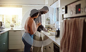 Black couple, cooking and helping with food in kitchen at home while together to cook healthy food. Happy young man and