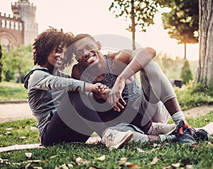 Black couple doing exercise outdoors