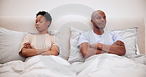 Black couple, fight and ignore in bedroom, conflict or marriage crisis together in home. Divorce, man and woman in bed