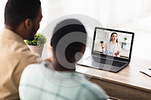 Black Couple Having Video Call Online Consultation With Manager Indoor