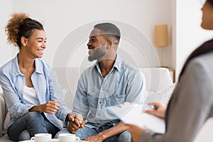 Black Couple Smiling And Laughing On Sofa After Effective Therapy