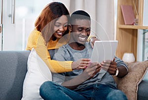 Black couple, tablet and online with digital app in home for streaming entertainment, movie or internet. Man, woman and